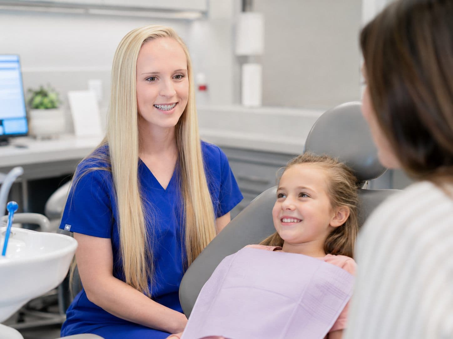 A child smiling during a dental checkup