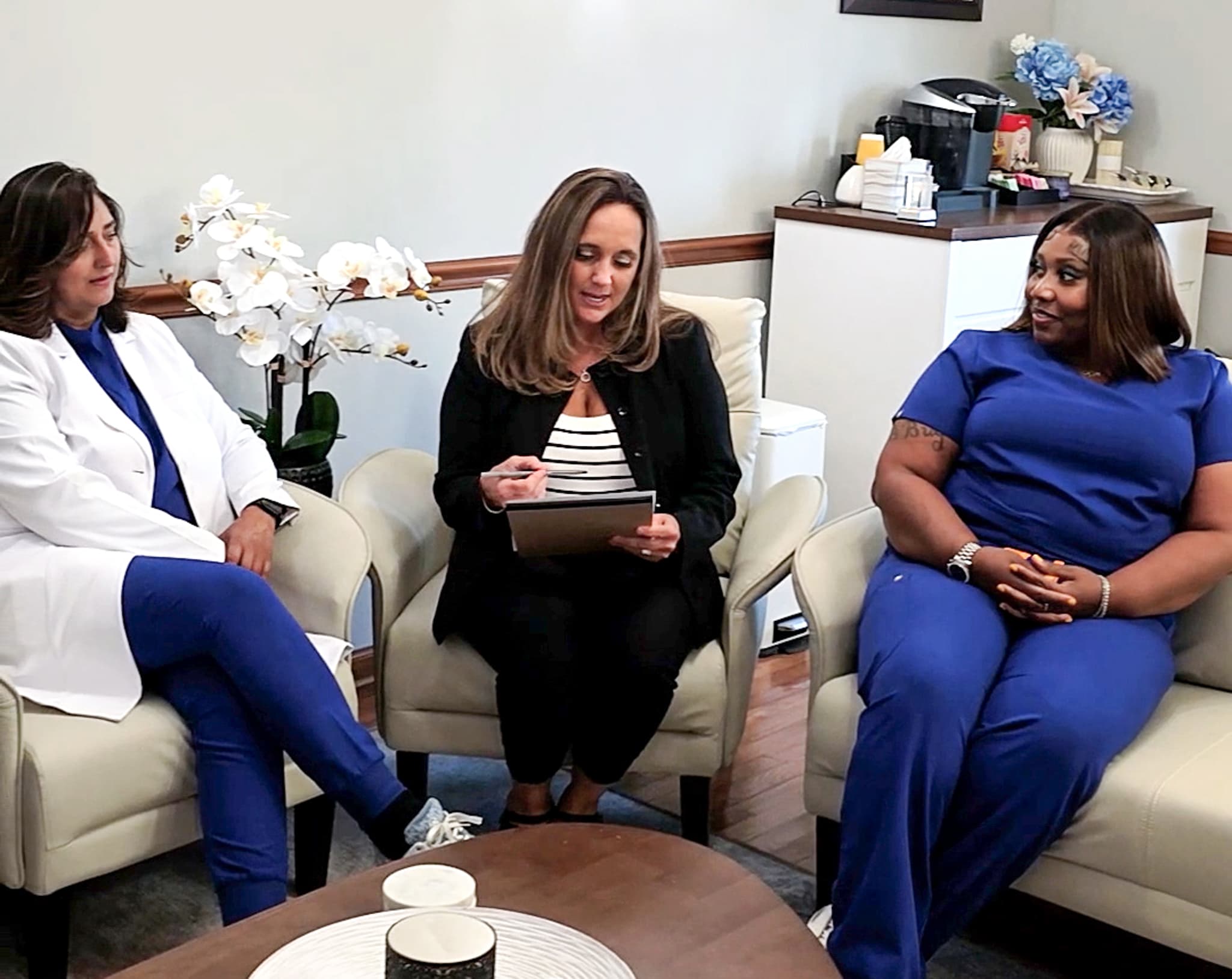 The Bright Family Dentistry team gathered in the waiting area