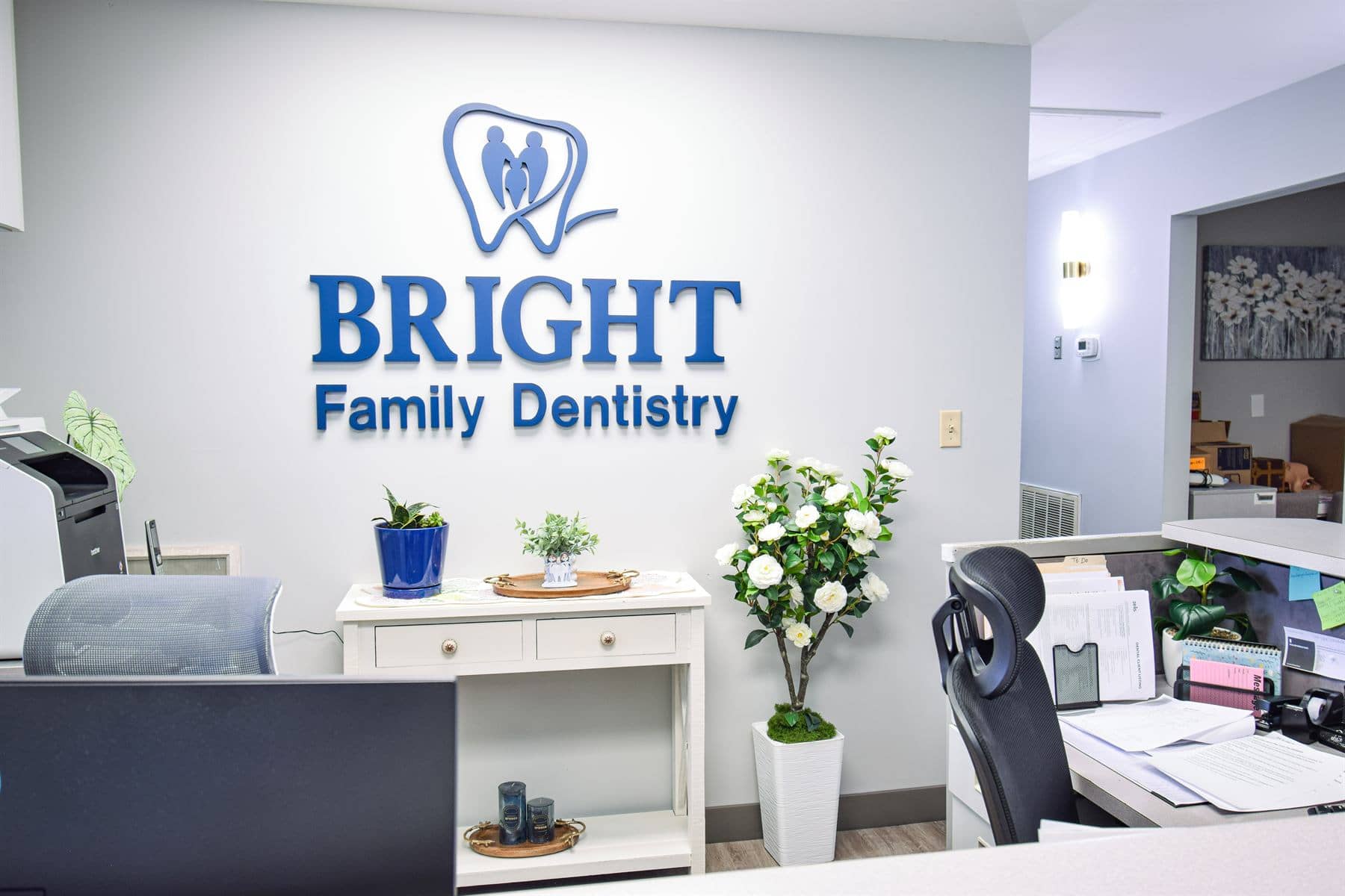 The reception area with the Bright Family Dentistry logo wall