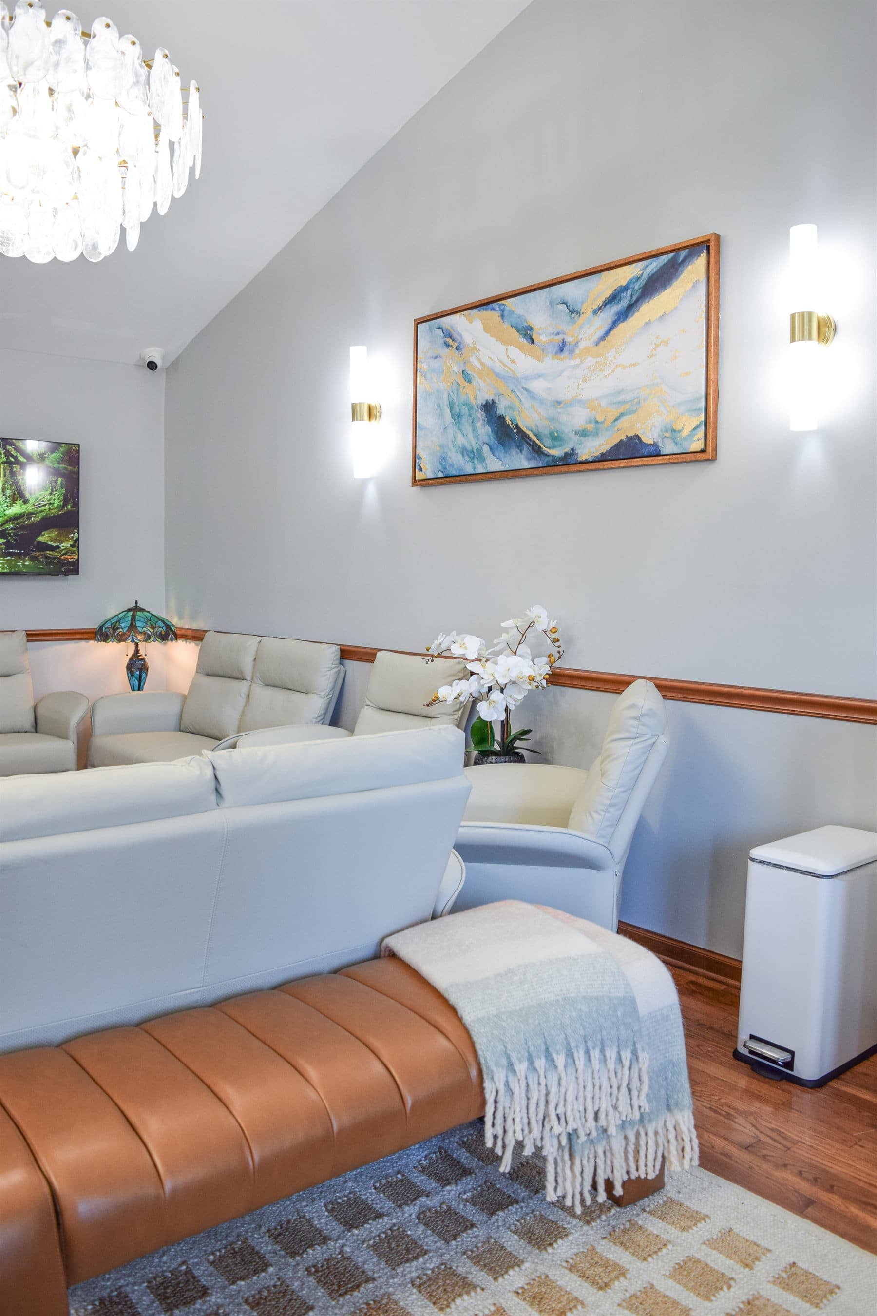 Comfortable recliners under the waiting room chandelier