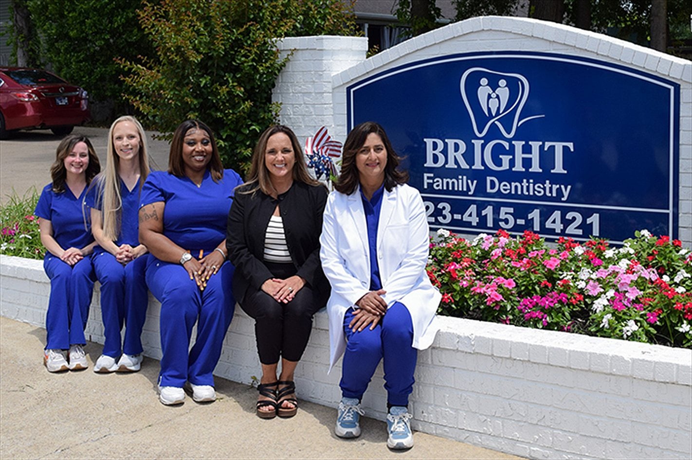 The Bright Family Dentistry team at the office sign in Chattanooga